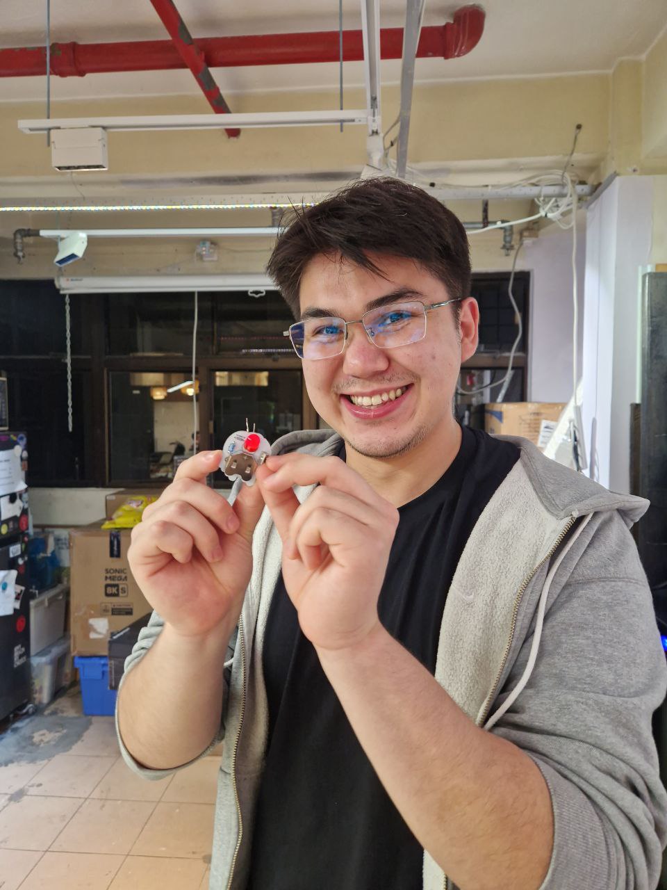 Smiling man with his first Dim Sum Labs LED pin.